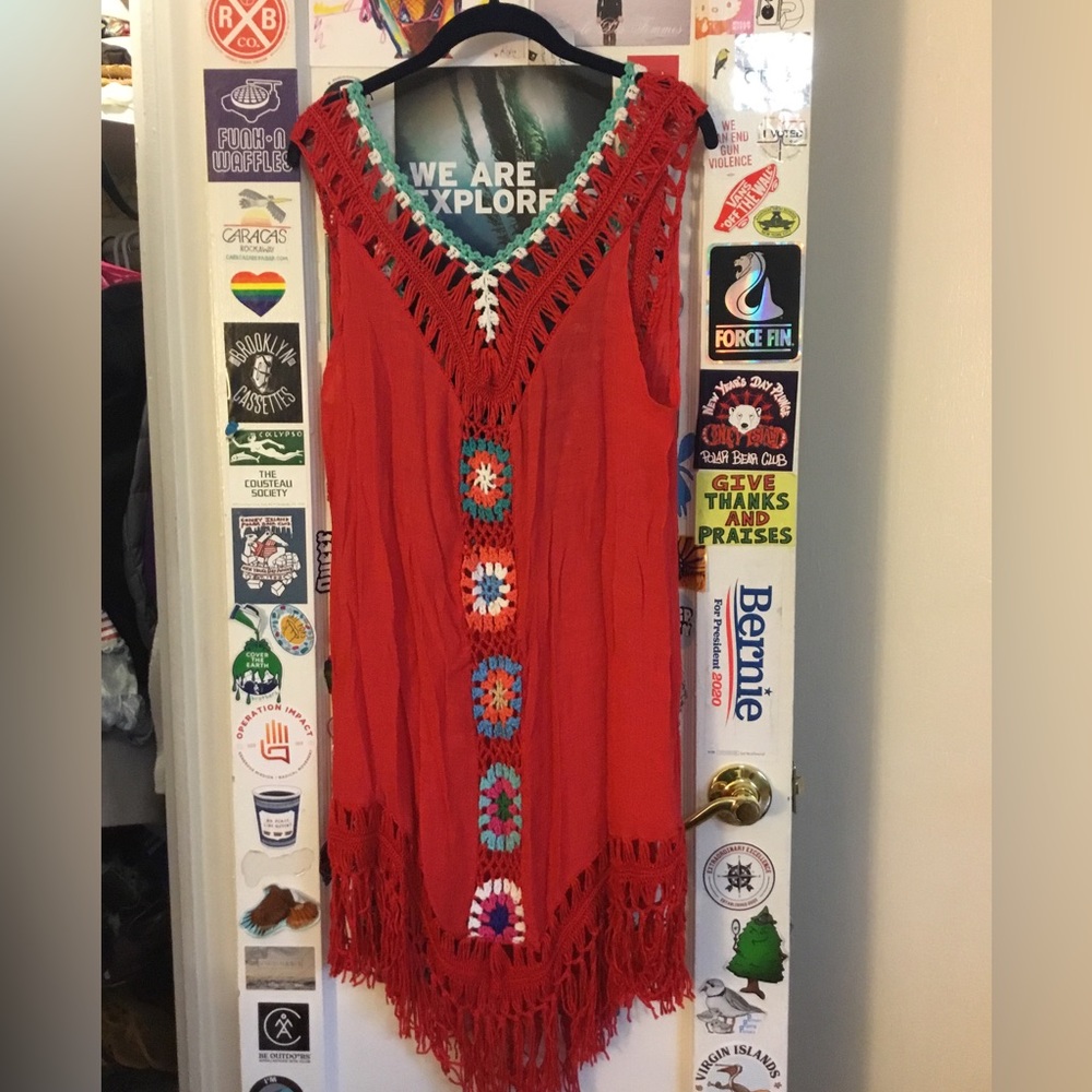 Red beach coverup with tassel accents and crotchet design